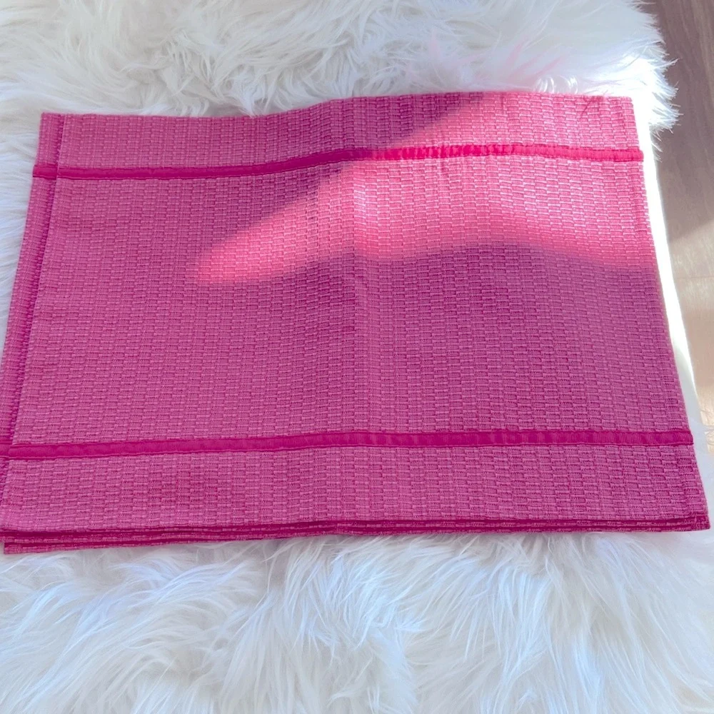 Set of four pink placemats with pink ribbon